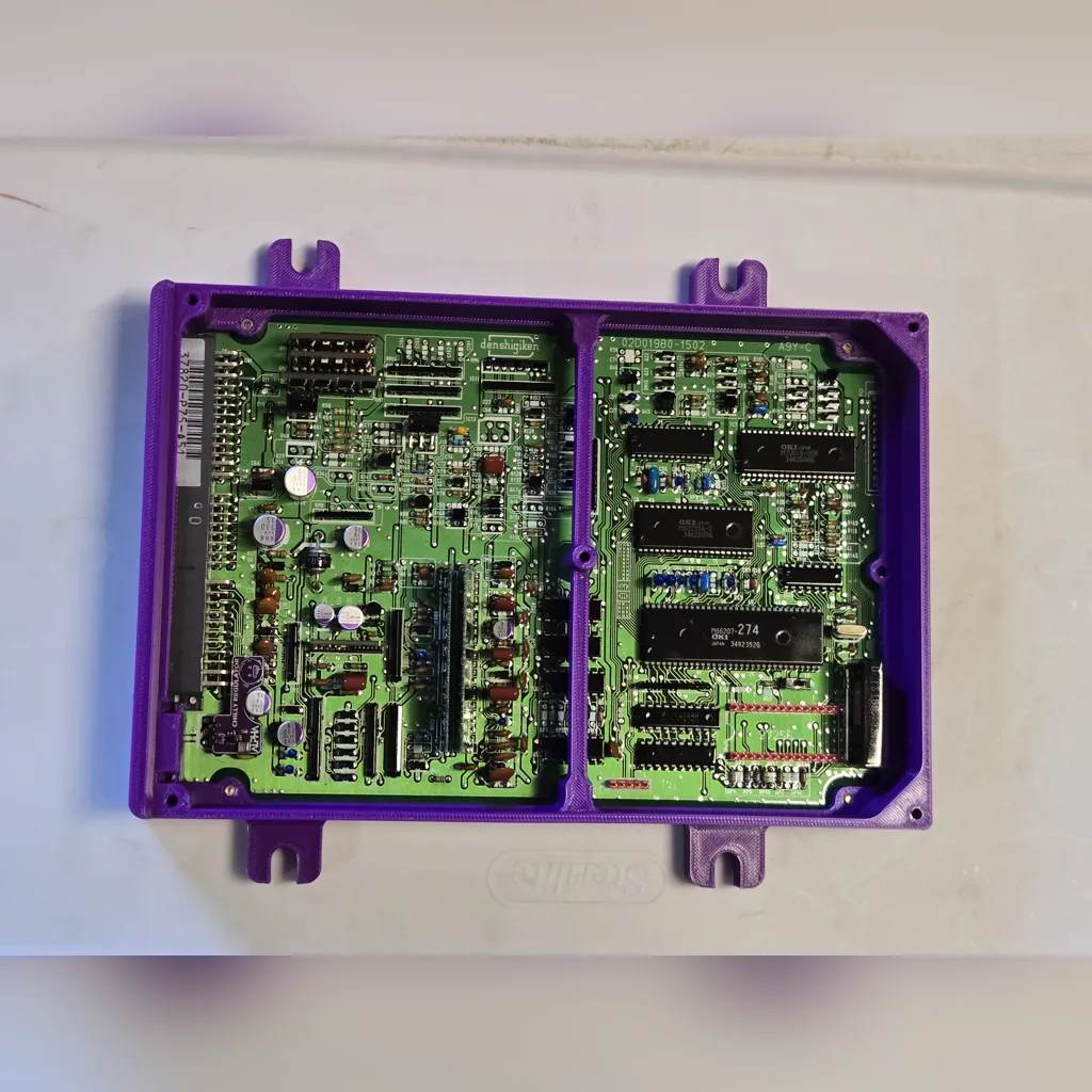 Refurbished OBD1 Honda ECU circuit board in a purple ALPHA case, top view