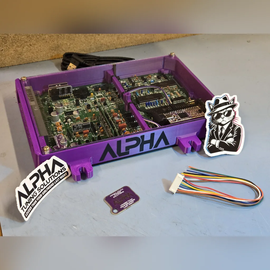 Refurbished OBD1 Honda ECU in an ALPHA purple case with an ALPHA NextGEN emulator, ALPHA stickers and a wiring harness
